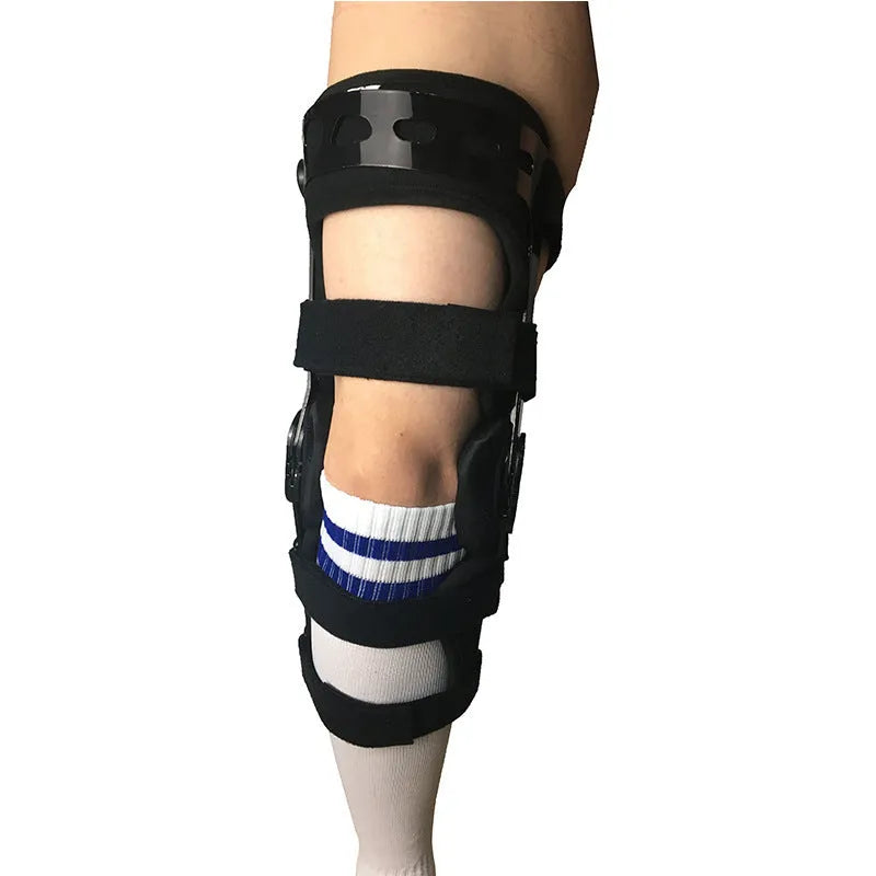 Black anterior ligament knee pad supporter showing multi-material construction and buckle fastenings.