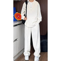 Men's black casual two-piece suit with long sleeve polo shirt and matching trousers