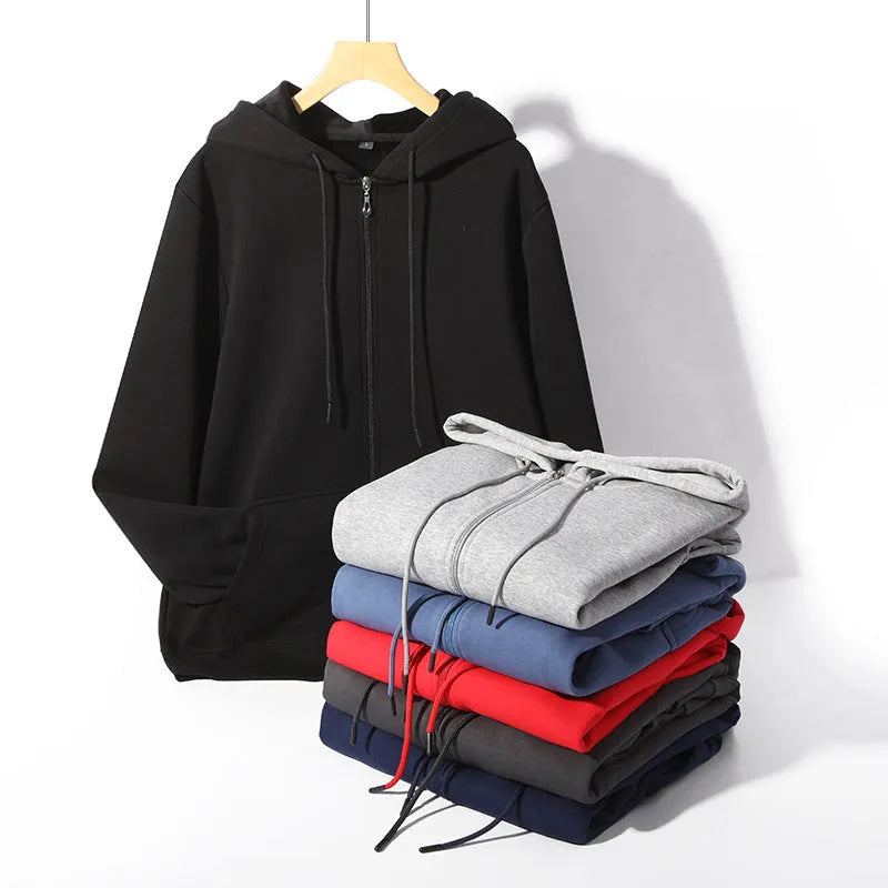 Man wearing a beige heavyweight zip-up hooded sweater, showing the front zip, hood, and top-stitch pocket detail.