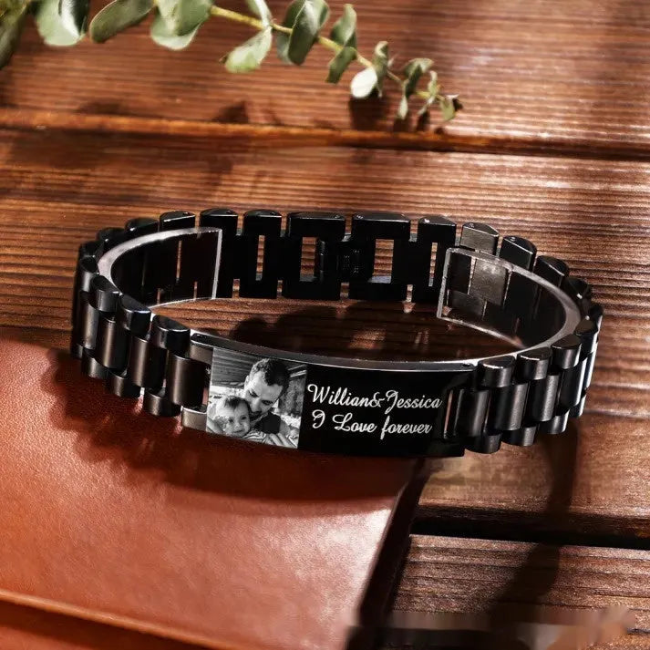 Titanium steel men's bracelet with curved heart shape and engraved lettering in black or grey finish