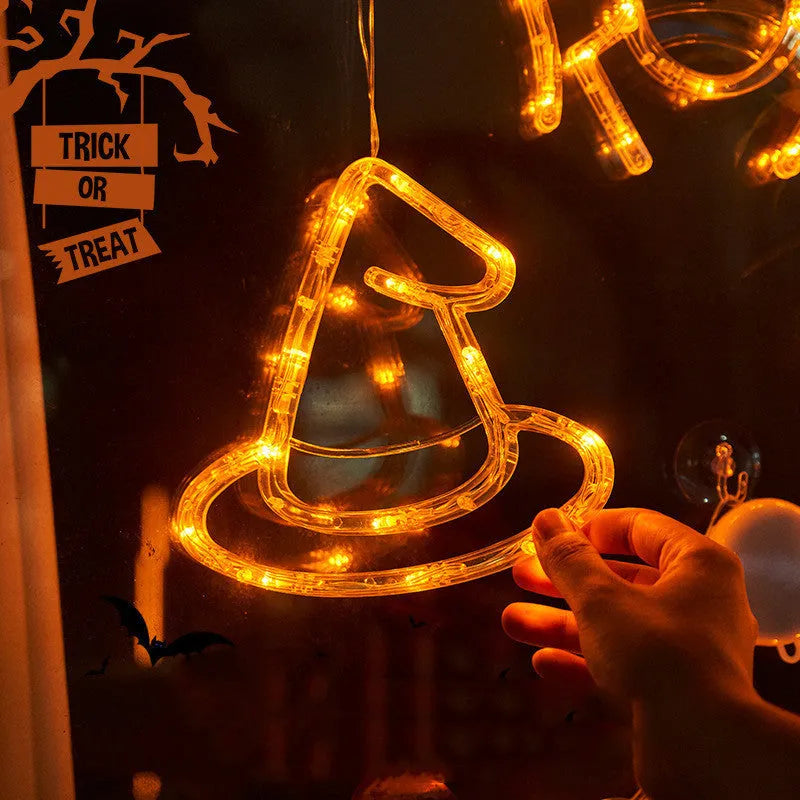 Halloween window hanging LED lights set with spider and pumpkin designs using suction cup installation