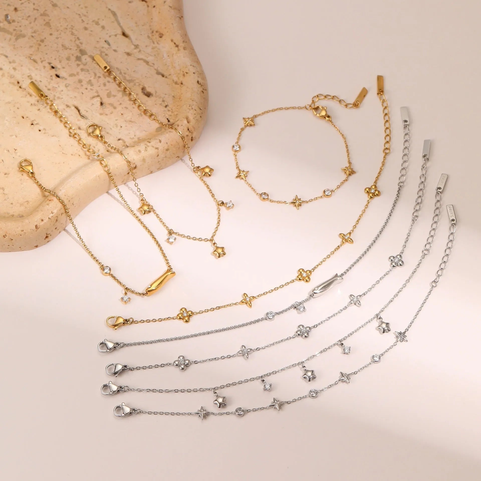 Gold-plated titanium steel women's bracelet with a geometric hexagonal star zircon pendant.
