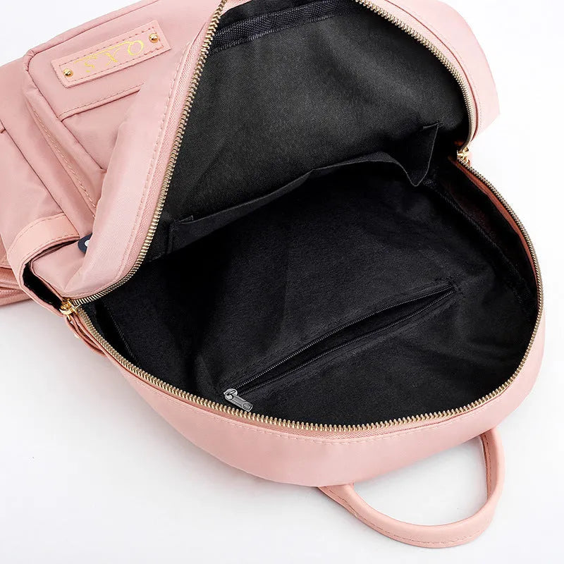 Black casual nylon backpack with shoulder straps showing internal organisation compartments