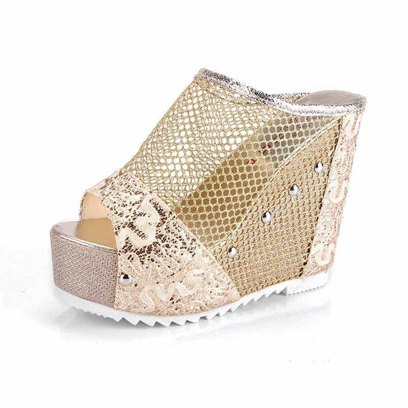 Black platform flip-flops with a chunky heel, hollowed-out design, and mesh upper on a white background.
