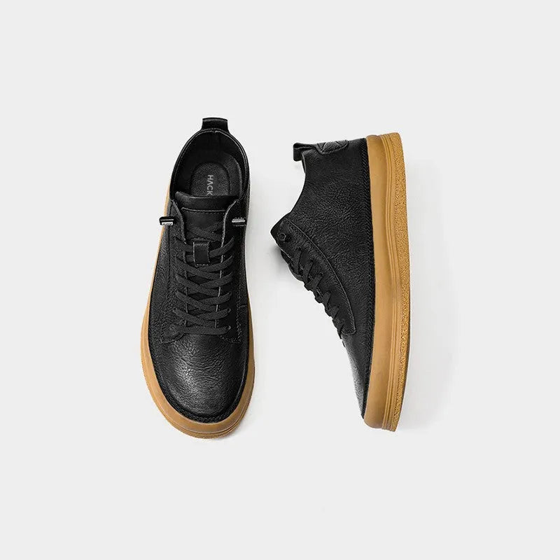 Men's black leather casual lace-up shoes with a round toe and flat rubber sole.