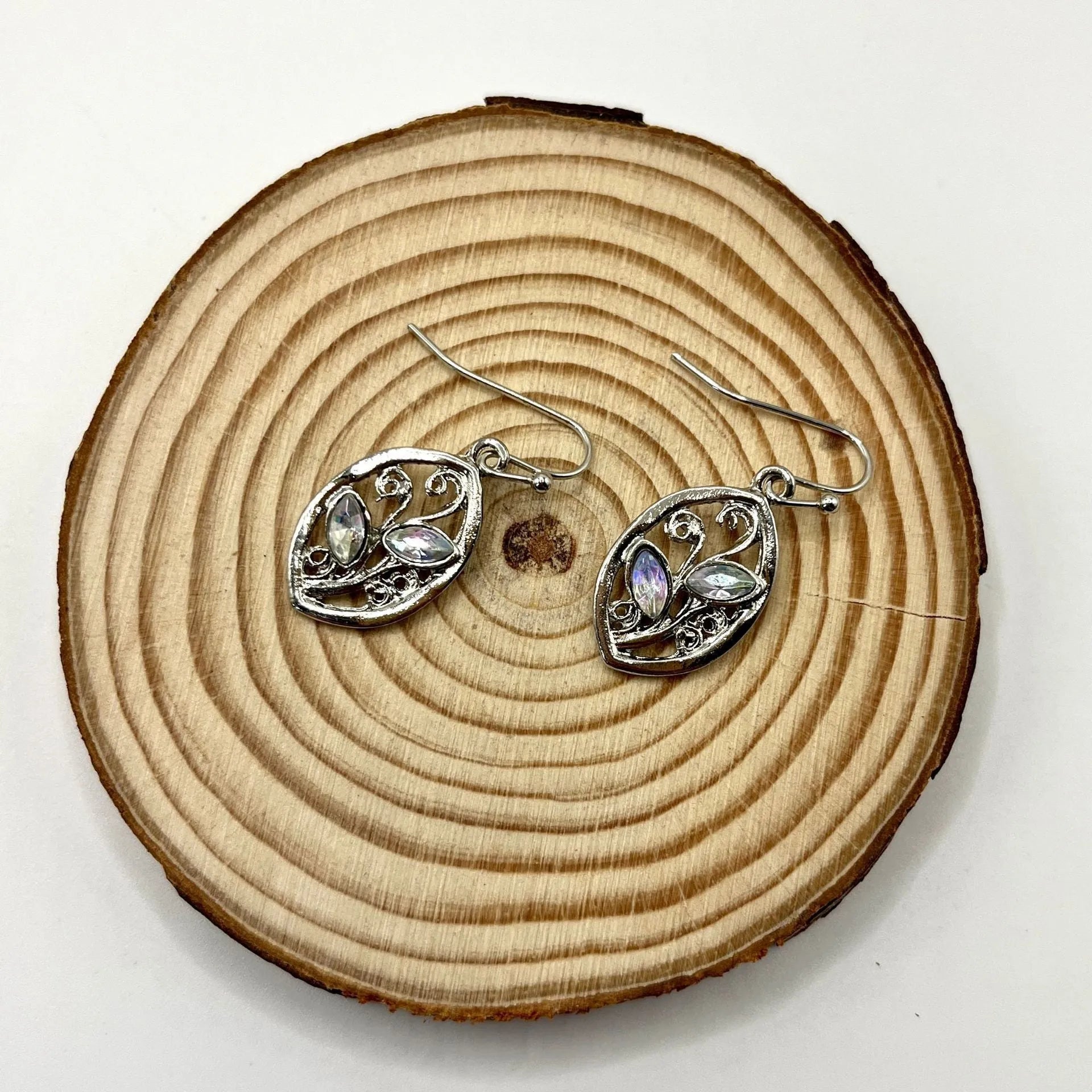 Silver women's earrings with leaf design and colourful embedded moonstones