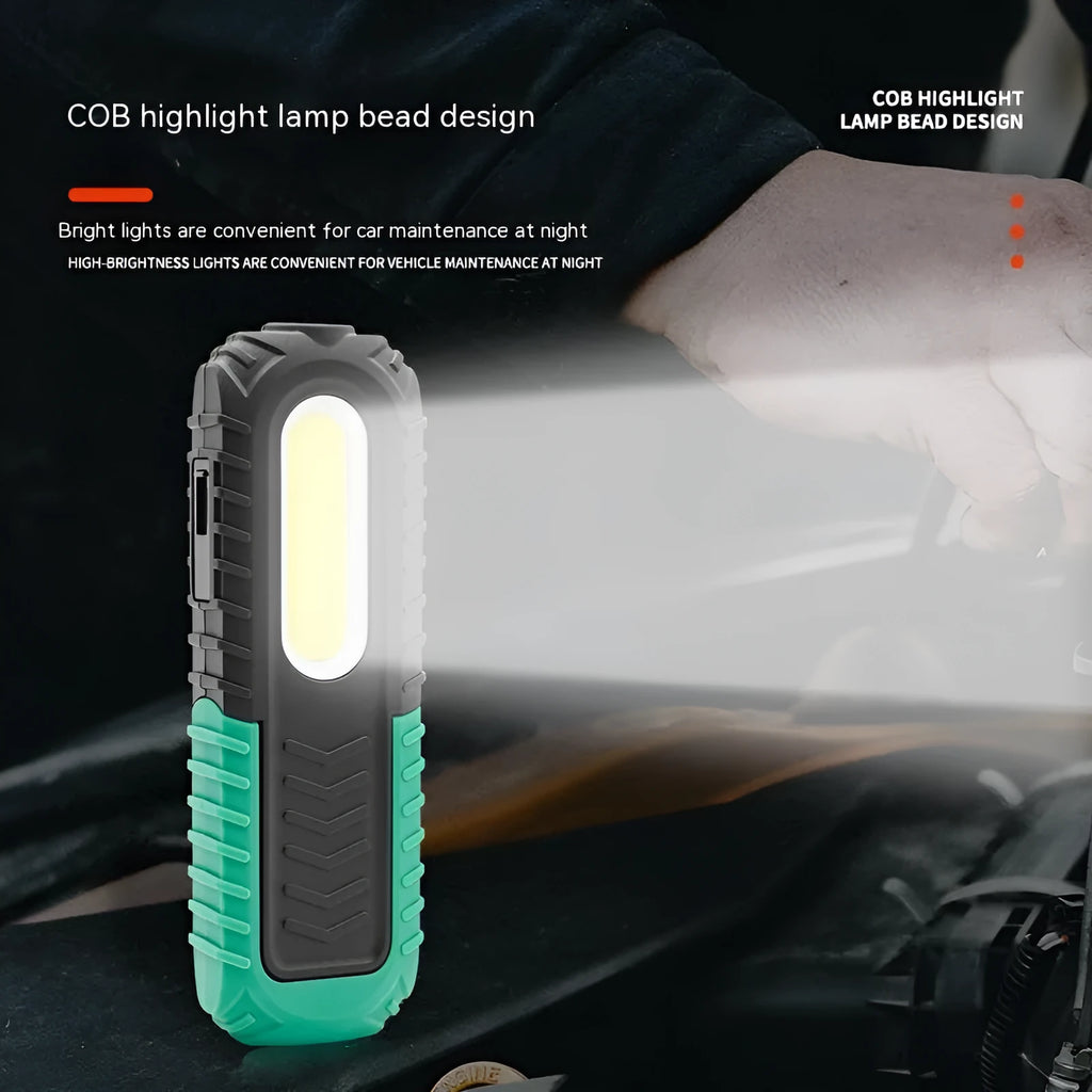 Black and green USB-charging auto repair work light with compact handheld design