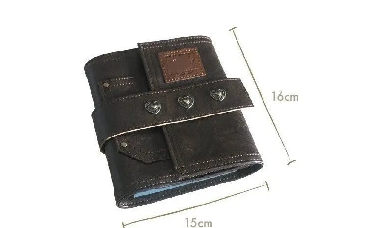 Brown A7 notebook with leather-style buckle closure showing loose-leaf binding