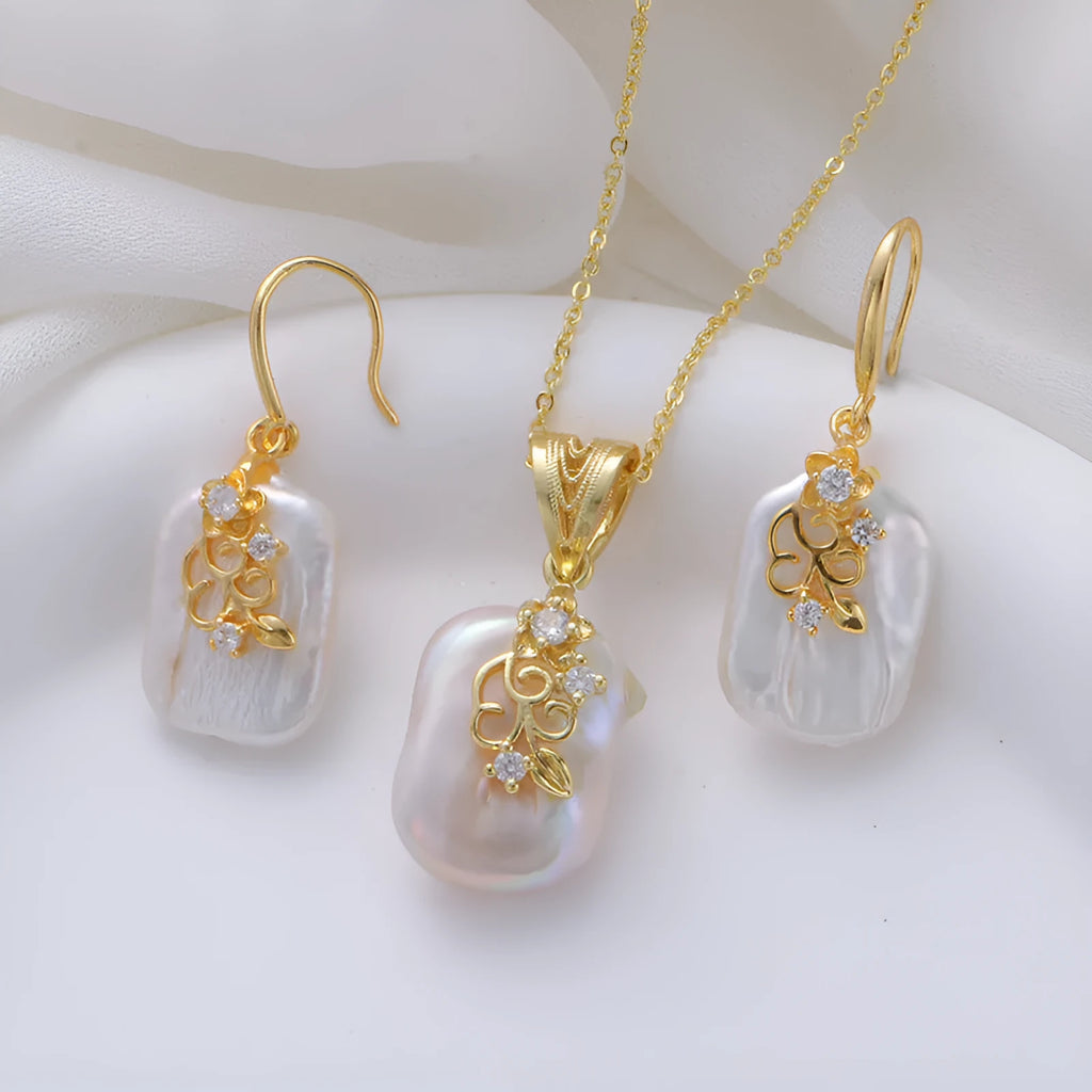 Women's matching baroque pearl geometry necklace with O-ring chain and earring set on display