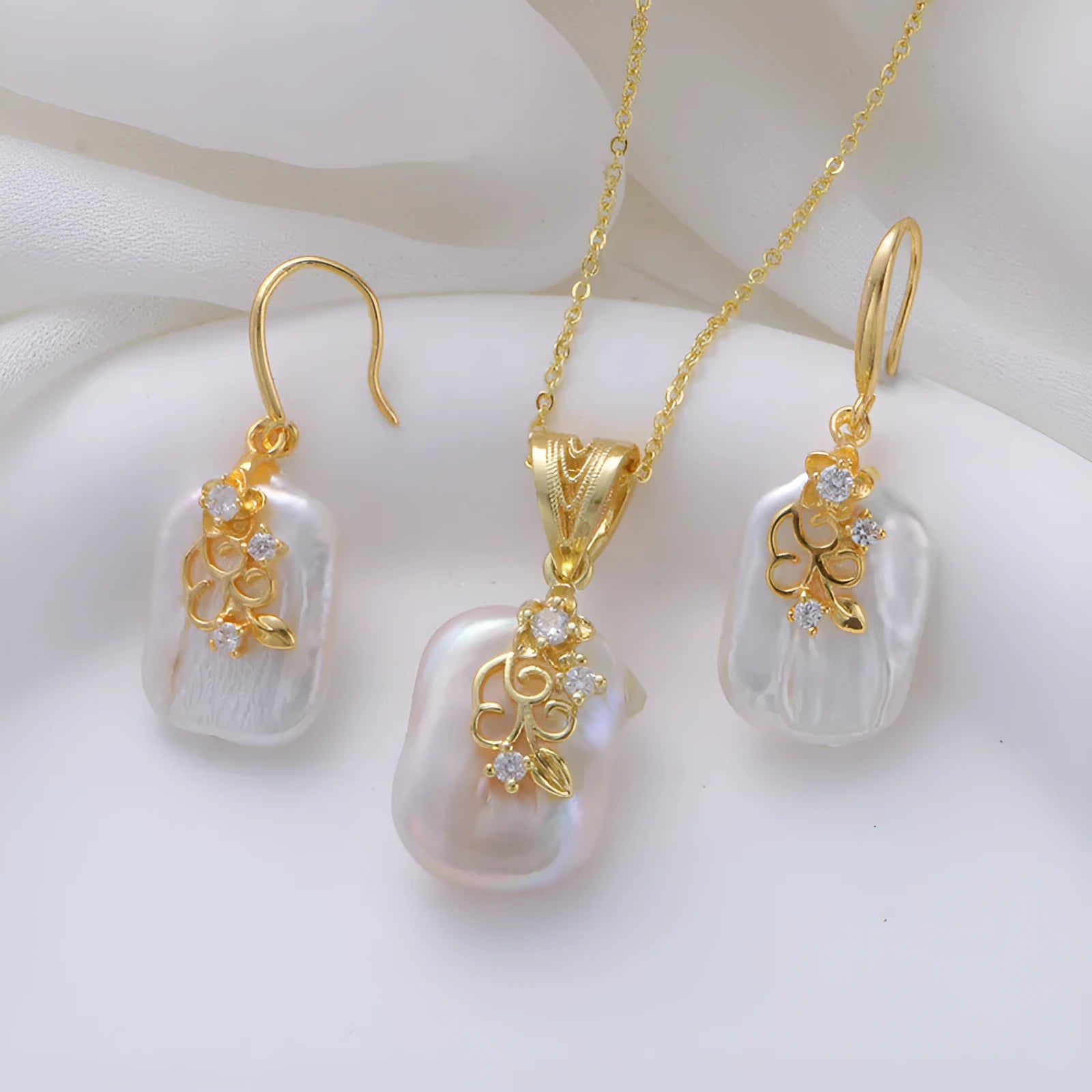 Women's matching baroque pearl geometry necklace with O-ring chain and earring set on display