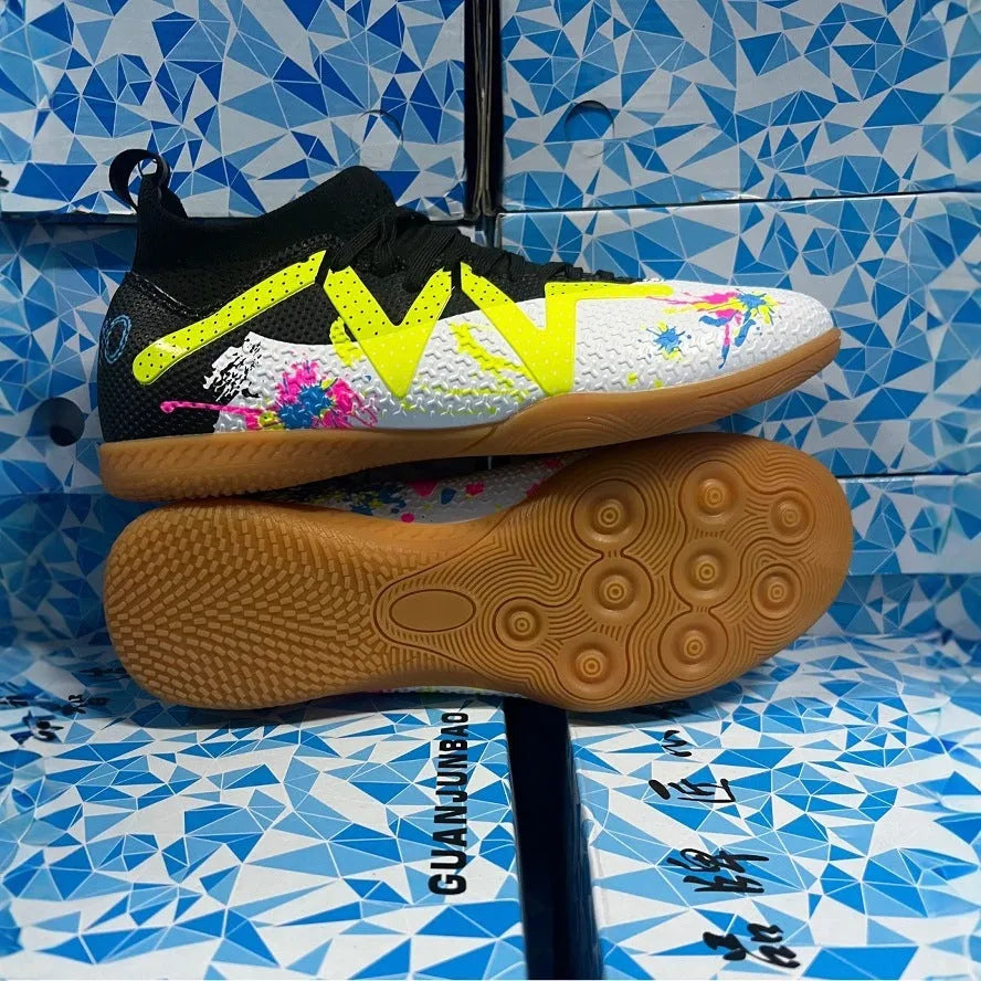 Adult low-top football boots with a PVC upper and rubber studded outsole, shown in black and yellow.