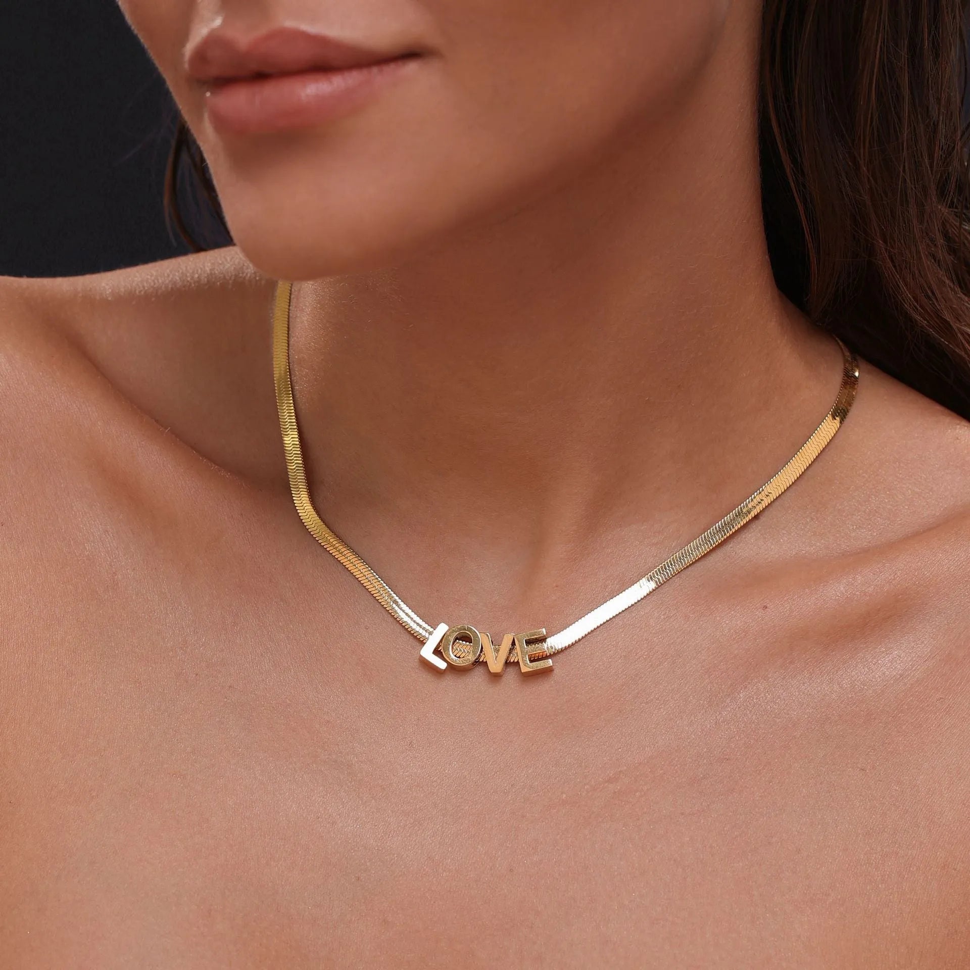 Gold electroplated titanium steel necklace with letter A charm on a 40.5cm blade chain