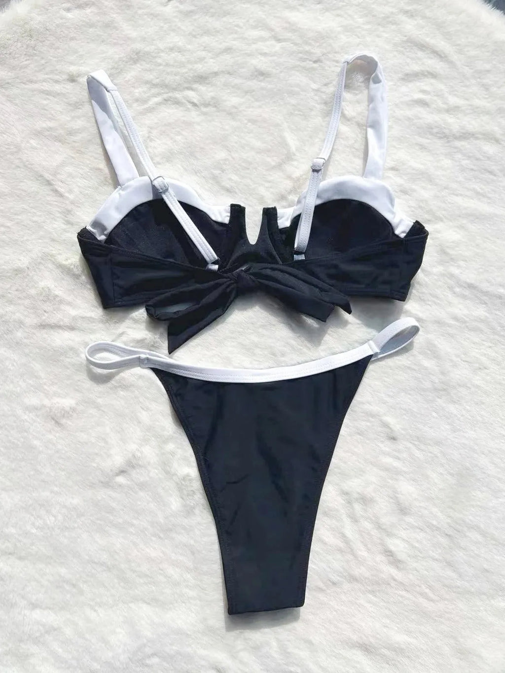 Low waist black women's bikini bottoms with stitching split, nylon spandex, front view