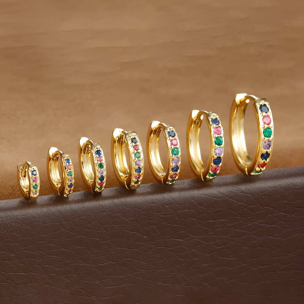 Round zircon perforated stud earrings in gold, rose gold, or silver colour with geometric design