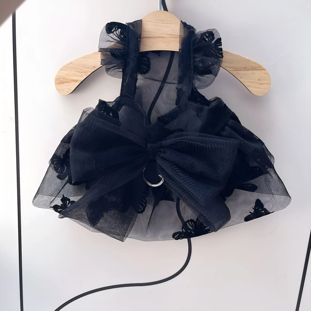 Black tulle princess skirt costume on small dog, showing tiered gauze design and adjustable fit.