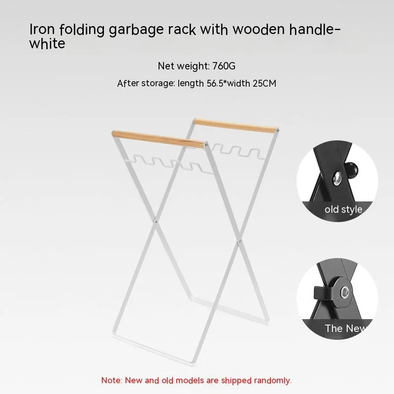 Black folding iron trash rack with a wooden handle holding a rubbish bag outdoors.