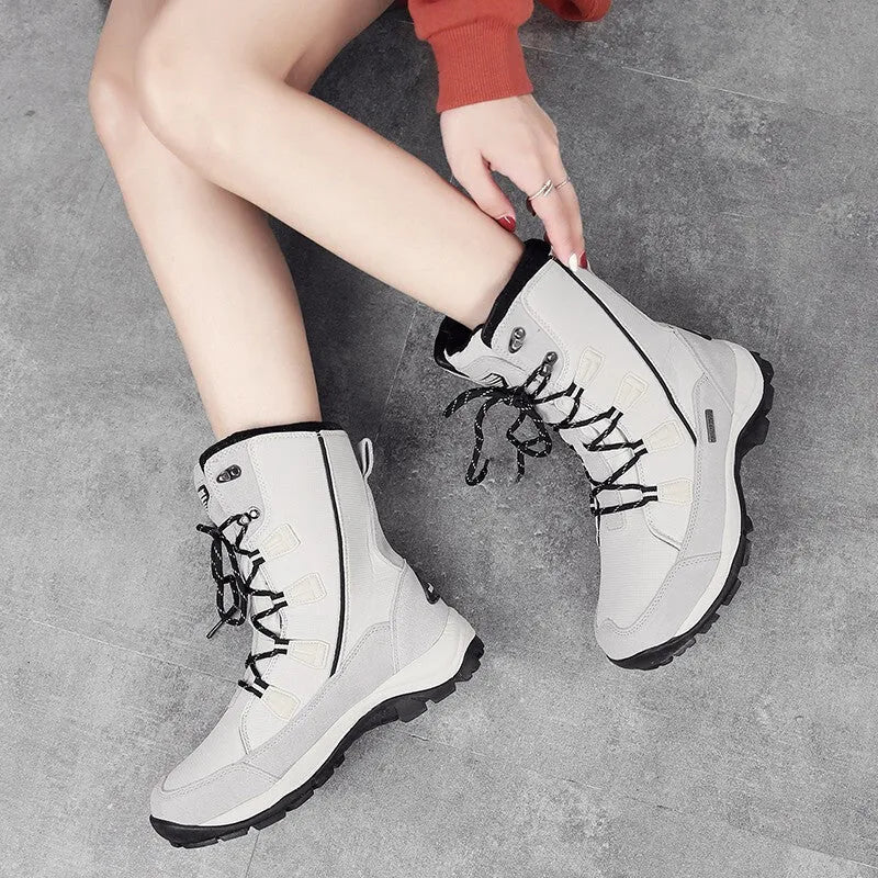Women's genuine leather mid-calf thermal snow boots in black with round toe and rubber sole