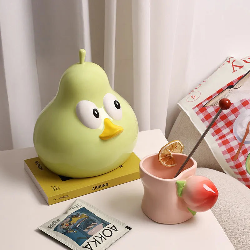 White ceramic pear-shaped tissue box holder in animal style with green finish