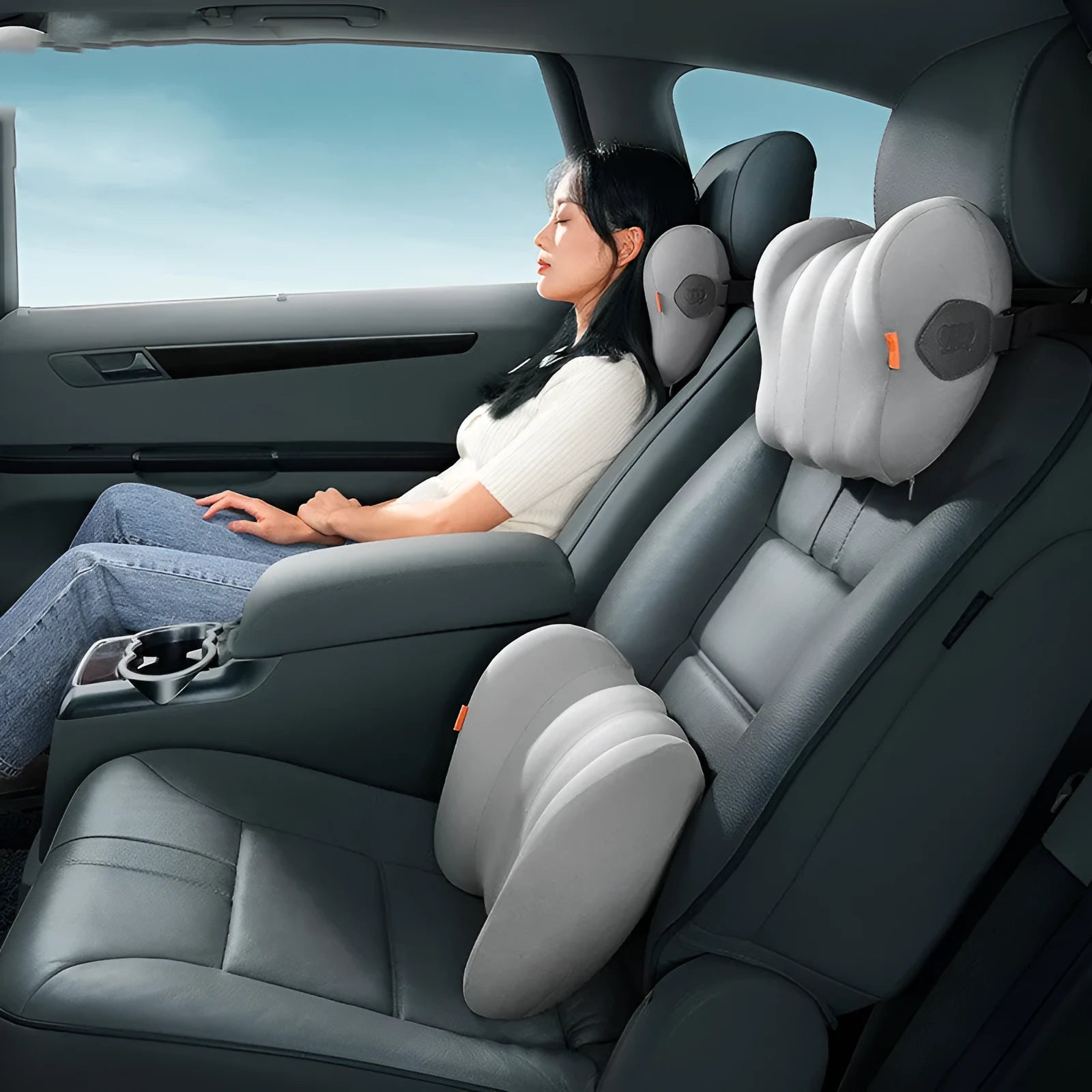 Grey and orange headrest and lumbar pillow set for commercial vehicle suspension bin systems