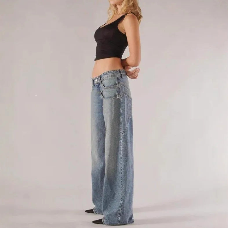 Women's blue cotton wide leg mop trousers with low waist and splicing detail laid flat.