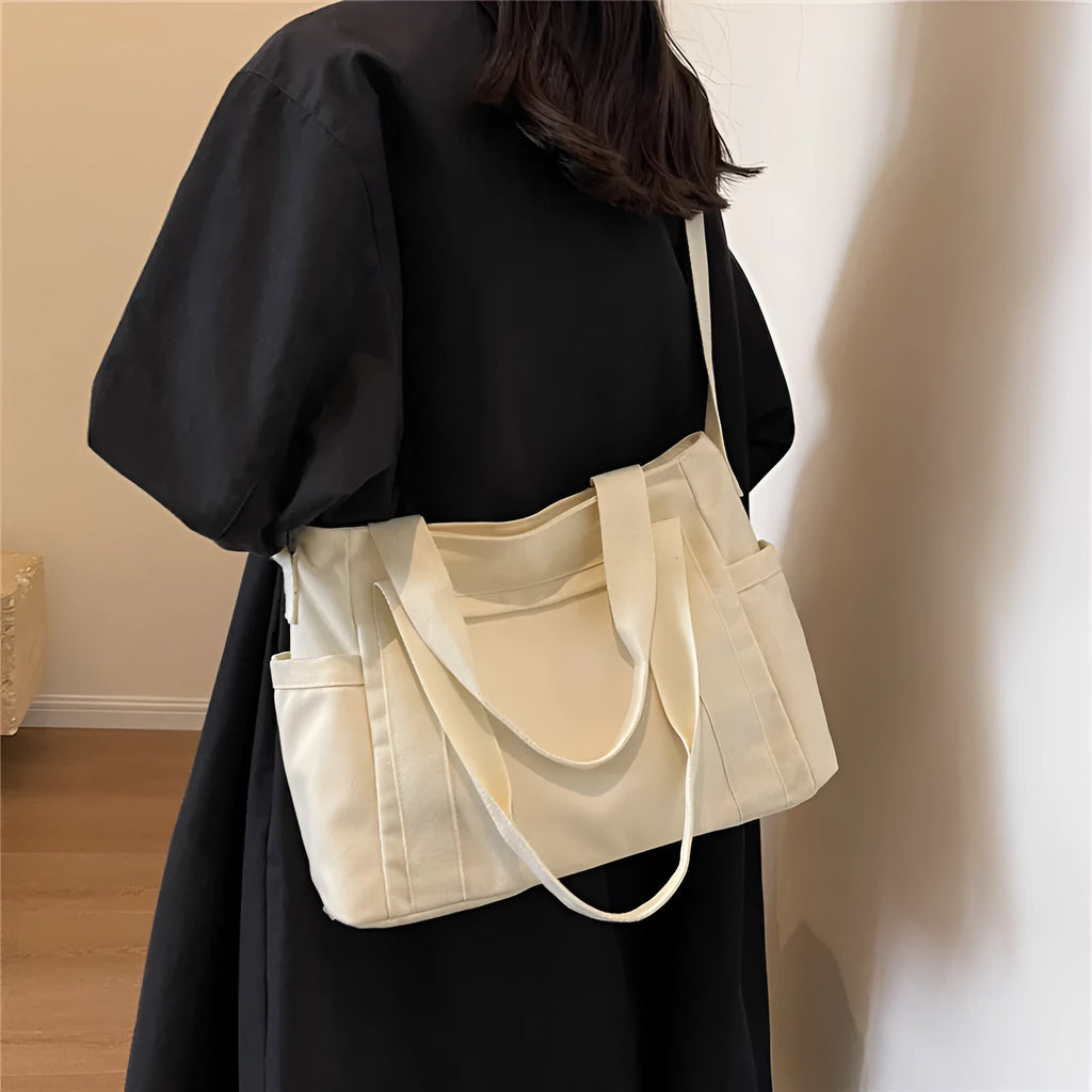 Women's polyester canvas shoulder tote bag in solid colour with exterior sandwich pocket