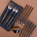 12-piece makeup brush set with synthetic bristles and wooden handles in PU travel roll