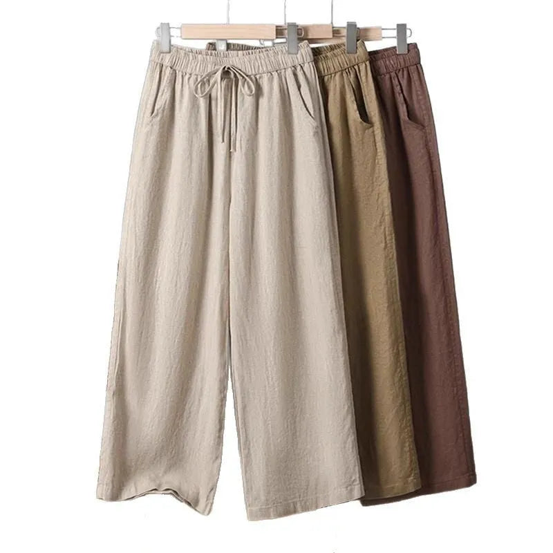Women's straight-leg casual trousers with an elasticated drawstring waist in apricot colour
