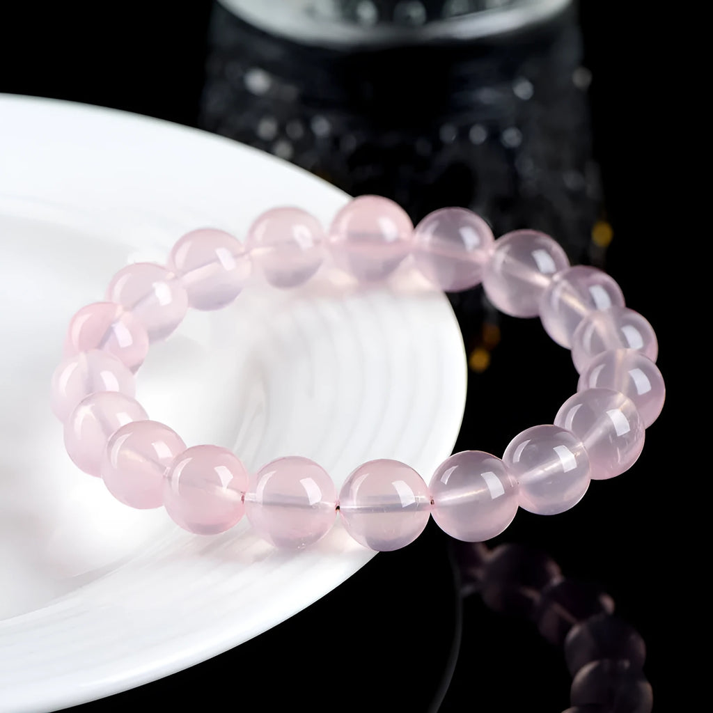 Natural starlight crystal women's bracelet with polished pink round beads in single circle design