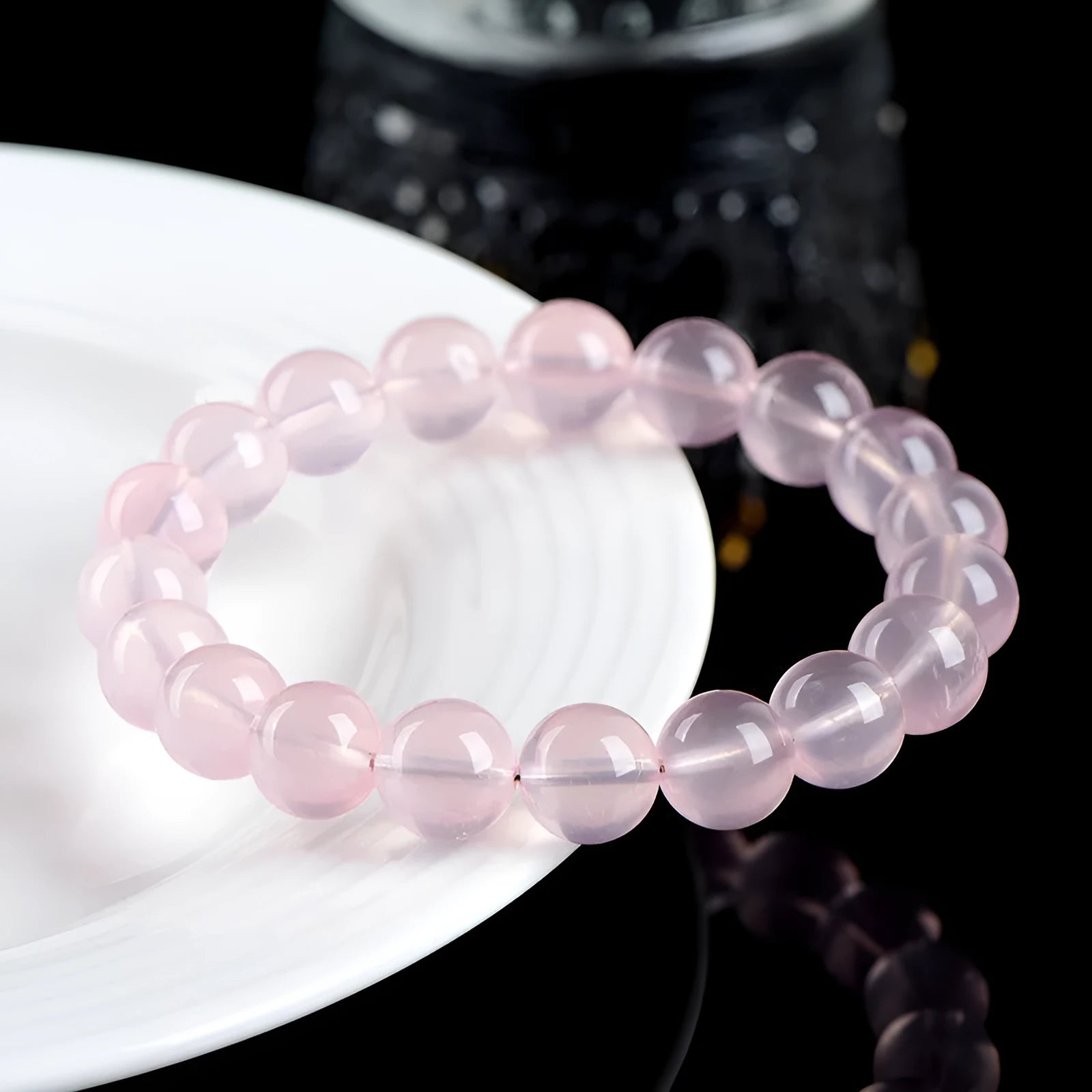 Natural starlight crystal women's bracelet with polished pink round beads in single circle design