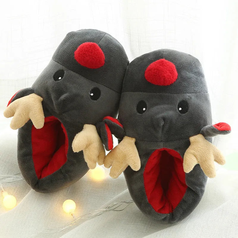 Grey super soft fleece home slippers with cute elk design, placed on a floor