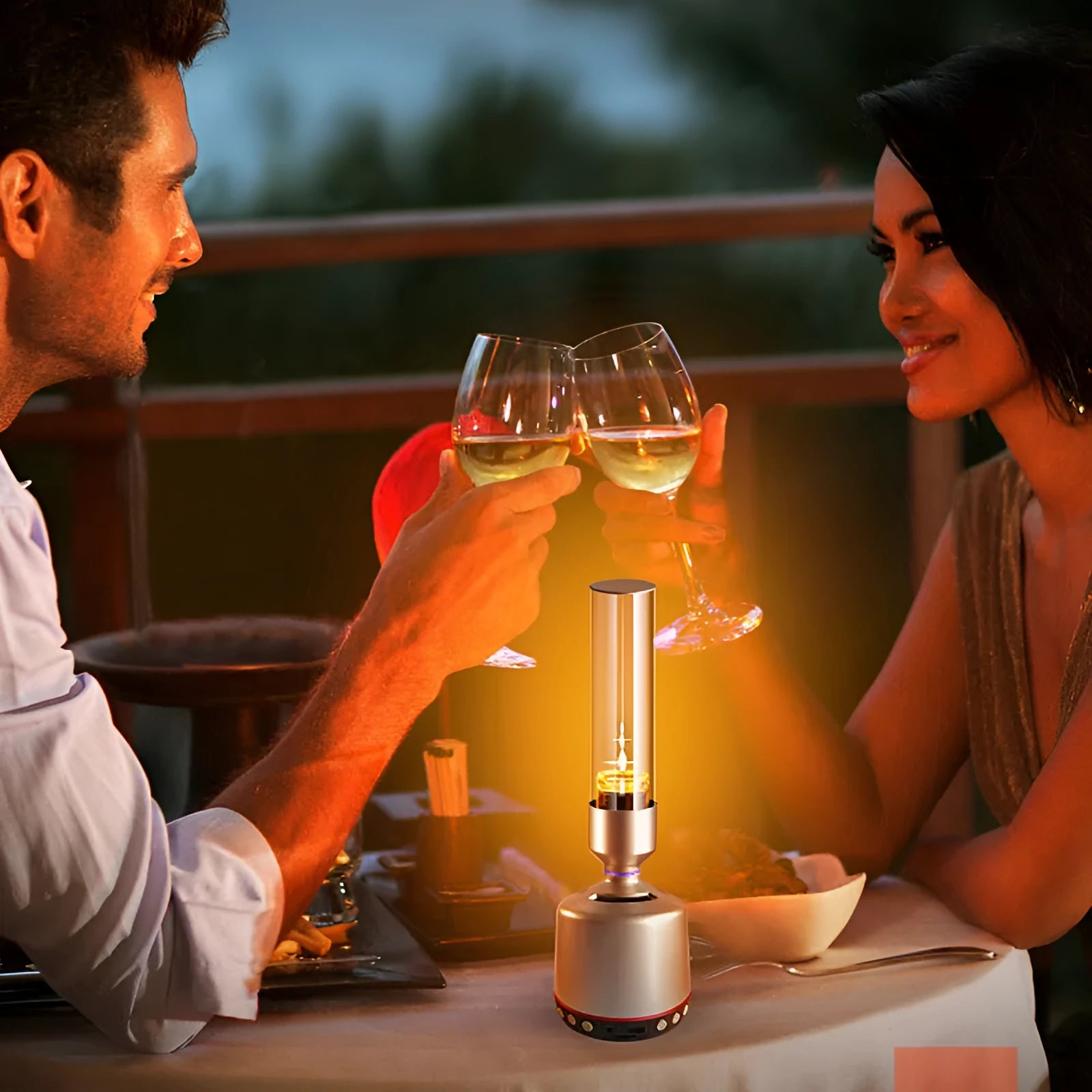 White silver candlelight Bluetooth speaker and night light on a table, showing modern cylindrical design.
