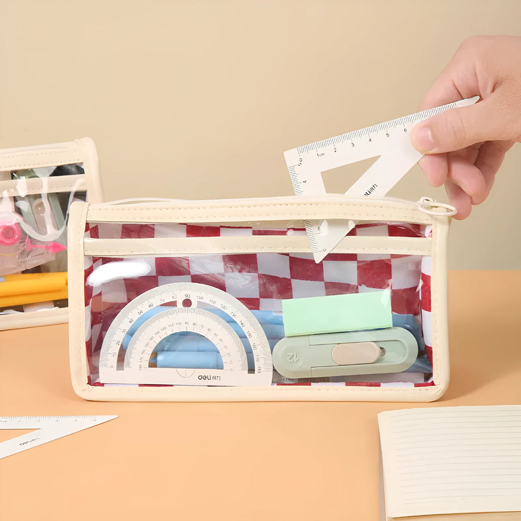 Transparent PVC pencil case with chessboard grid pattern showing pens inside, 21.5cm long