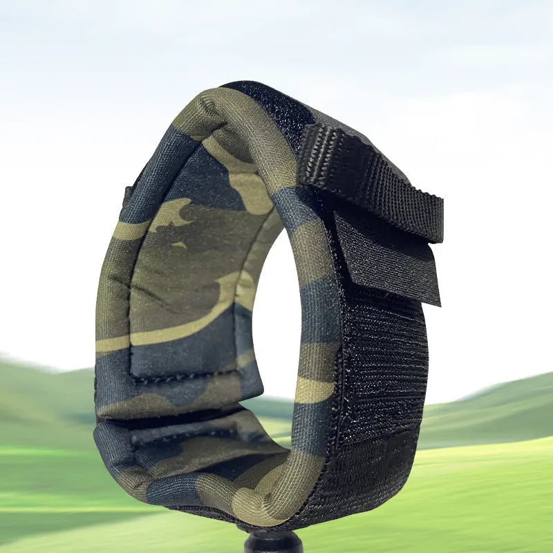 Surfboard hand holding rope made of beige pulp material coiled on a wooden surface