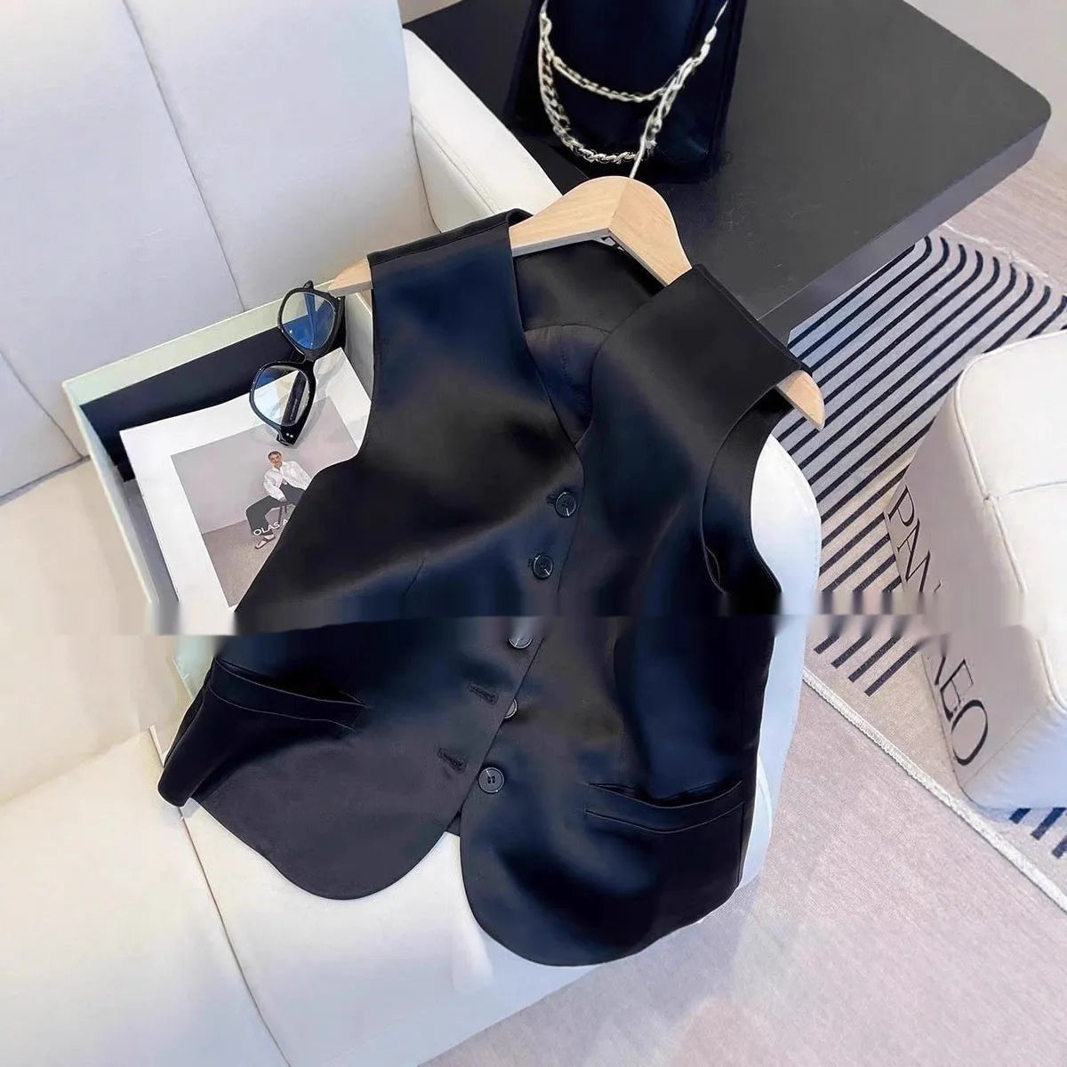 Black satin women's vest with loose fit and sleeveless design