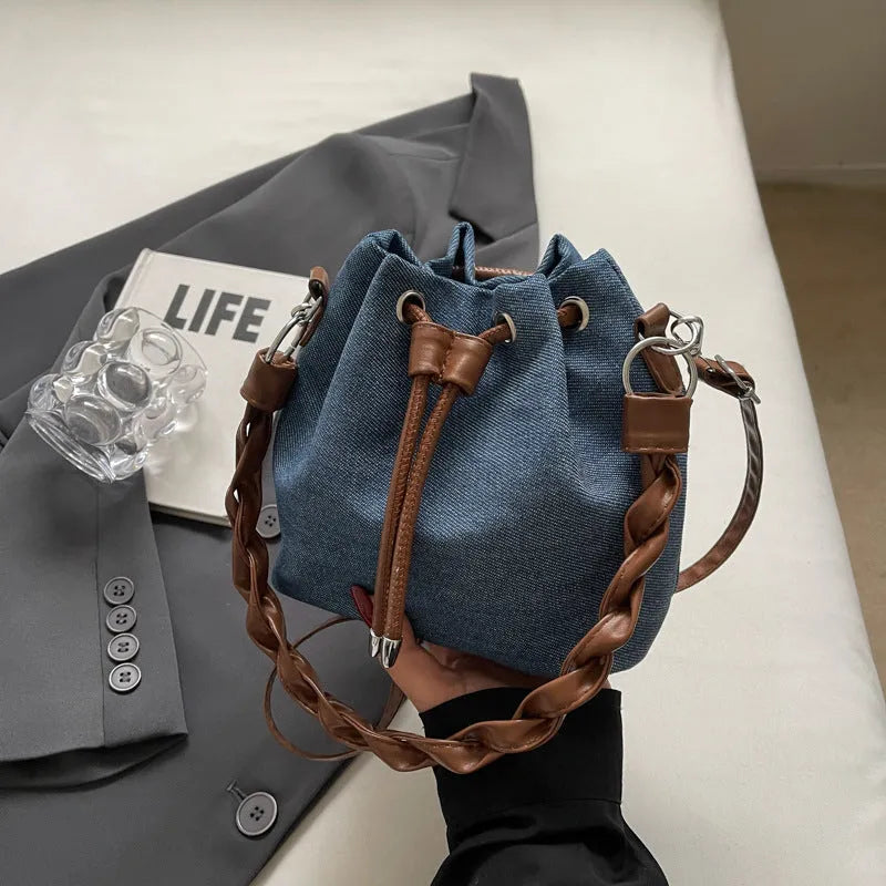 One-shoulder cross body bucket bag in blue colour with synthetic leather lining