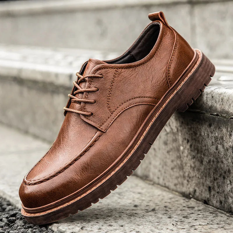 Men's tooling casual leather shoes in black, round toe low top with stitching details on rubber sole