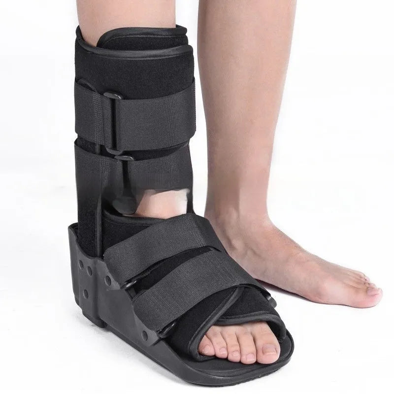 Grey Achilles tendon rehabilitation walking boot with aluminium supports and nylon straps.