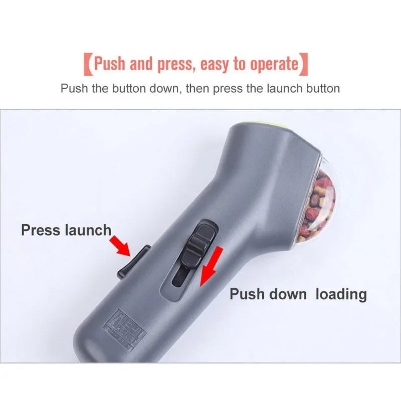 Grey plastic pet treat launcher measuring 18cm long with spring trigger for dog and cat training