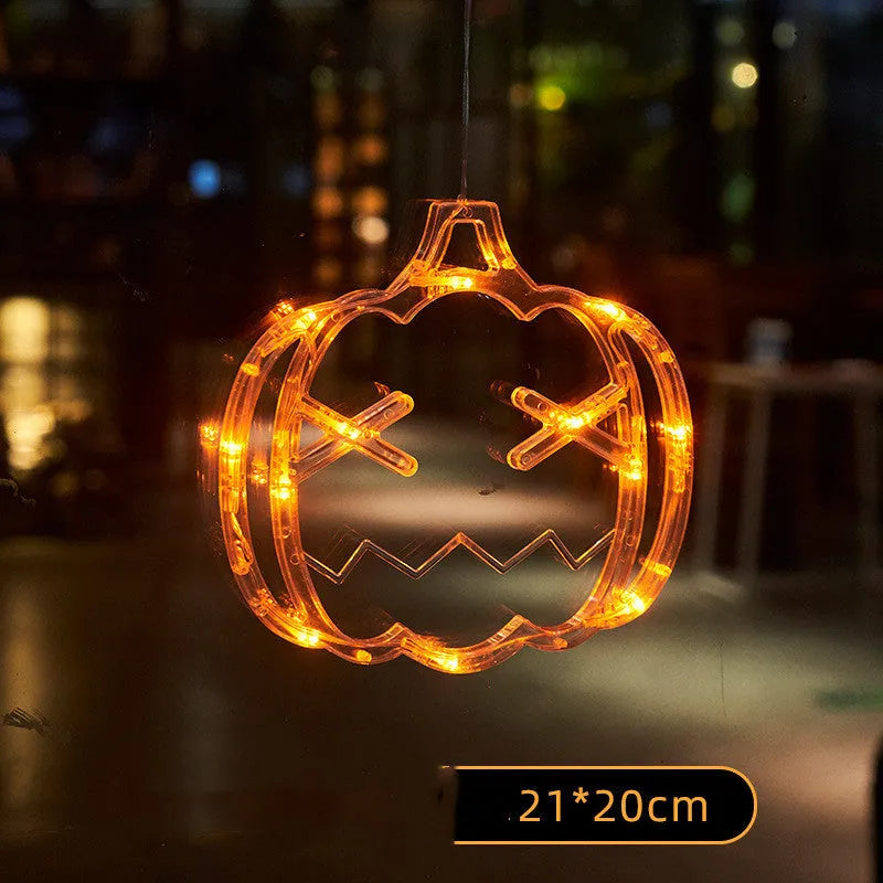 Halloween window hanging LED lights set with spider and pumpkin designs using suction cup installation