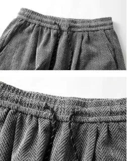 Men's straight-leg fleece-lined trousers in light grey, showing elastic waist and casual drape.