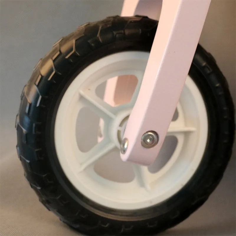 Pink wooden balance scooter for toddlers aged 1-6 years, 10 inches in size.
