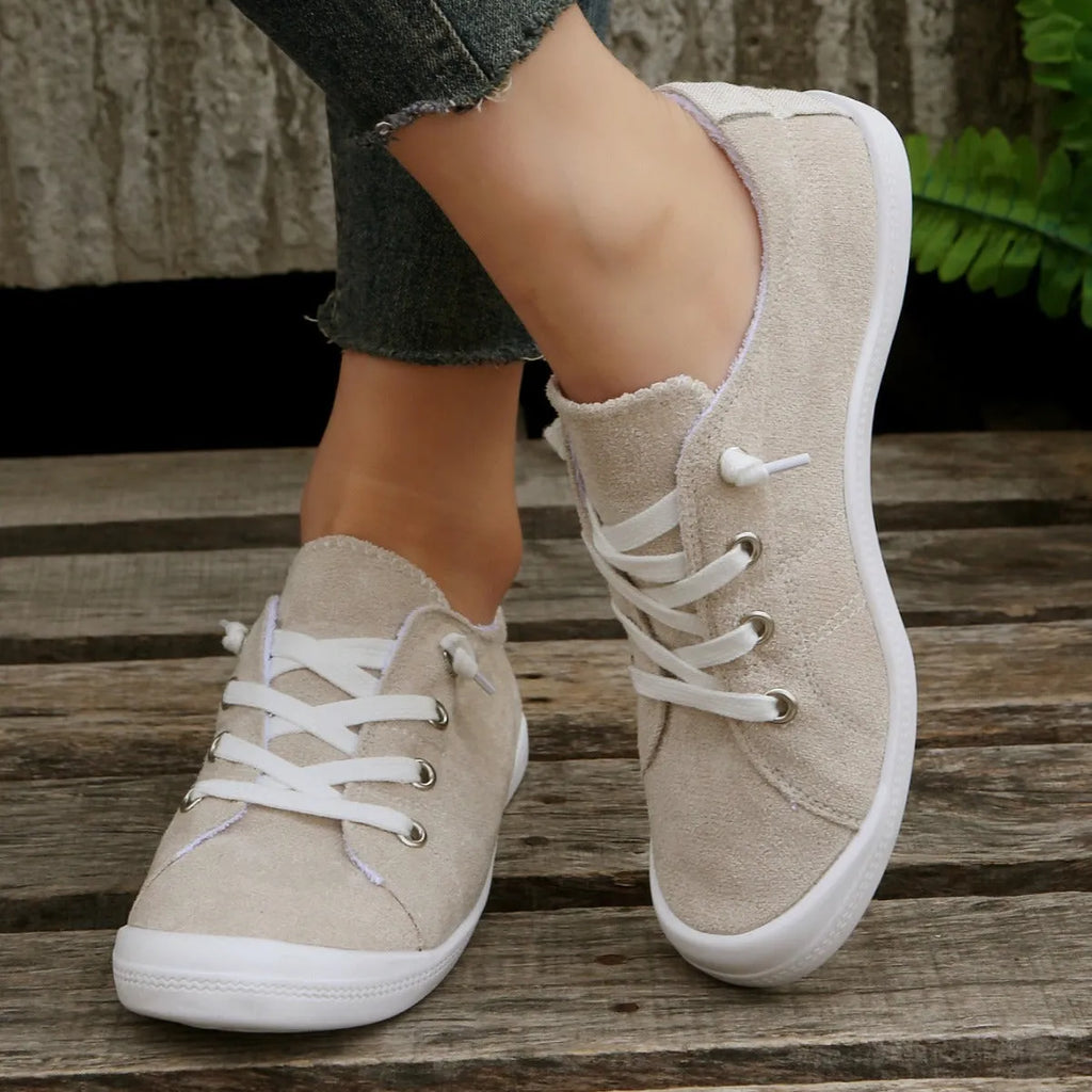 Women's creamy-white fabric casual sneakers with low-top design and rubber sole