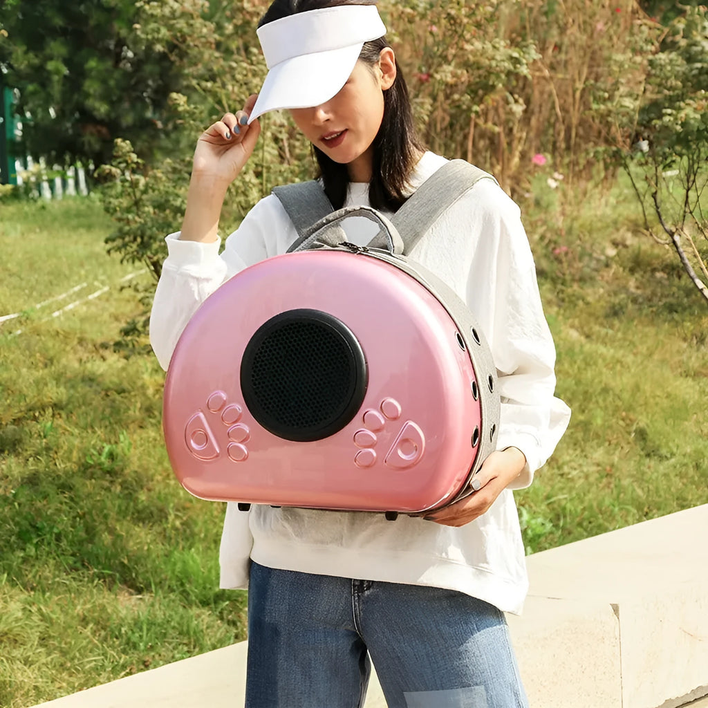 Transparent space capsule-shaped cat carrier bag with a handle in a choice of coloured front covers.