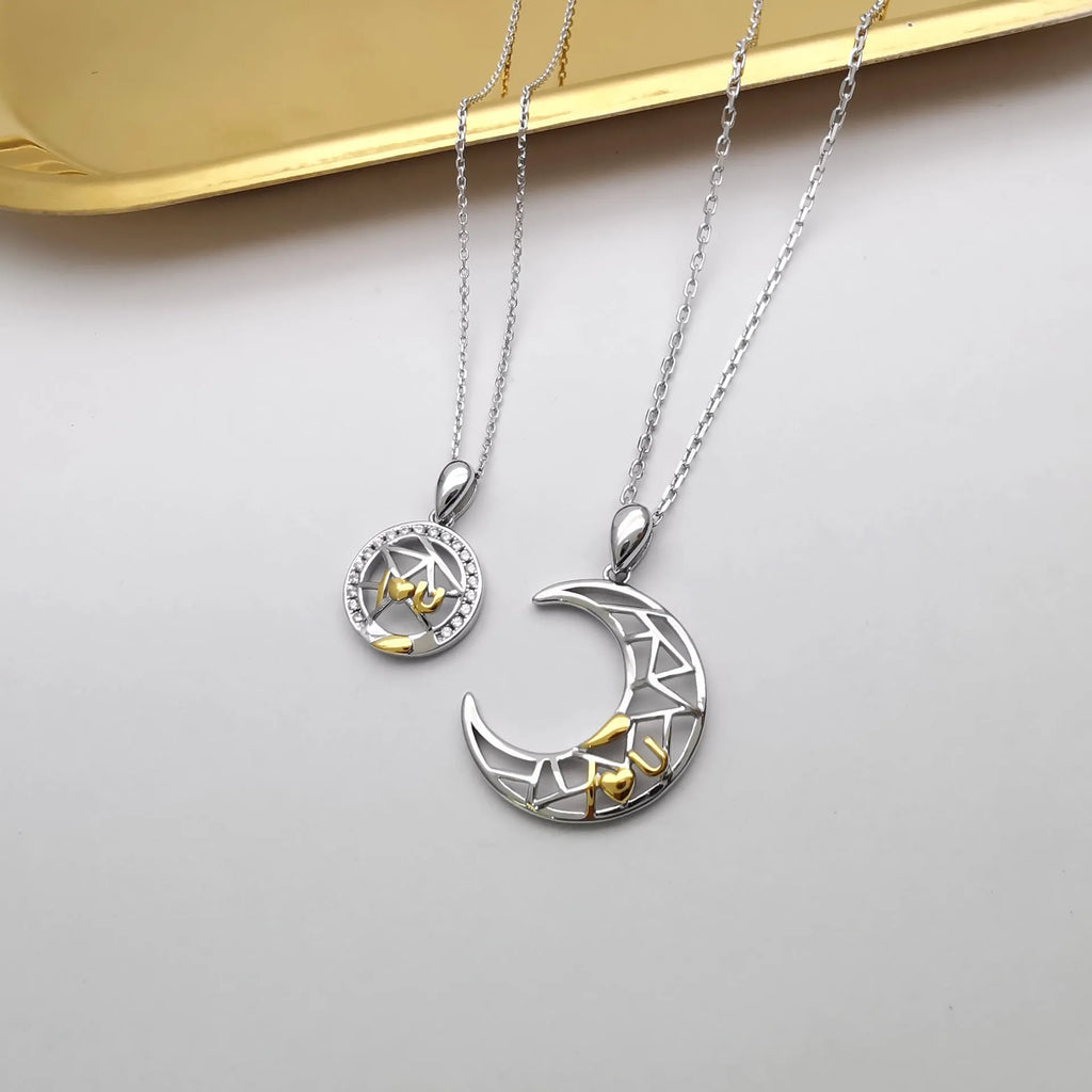Copper sun and moon tooth couple necklace with electroplated finish on cross chain.