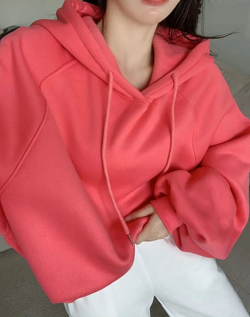 Watermelon red women's sleeveless hooded sweater in mulberry silk fabric on hanger