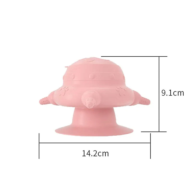 Pink silicone pet nursing bottle with bionic breast-shaped pacifier on a flat base, with three additional pacifiers.