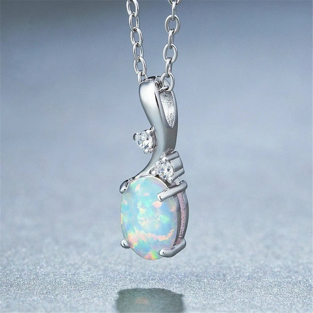 Water drop opal pendant necklace on an adjustable O-chain in rose gold or white.