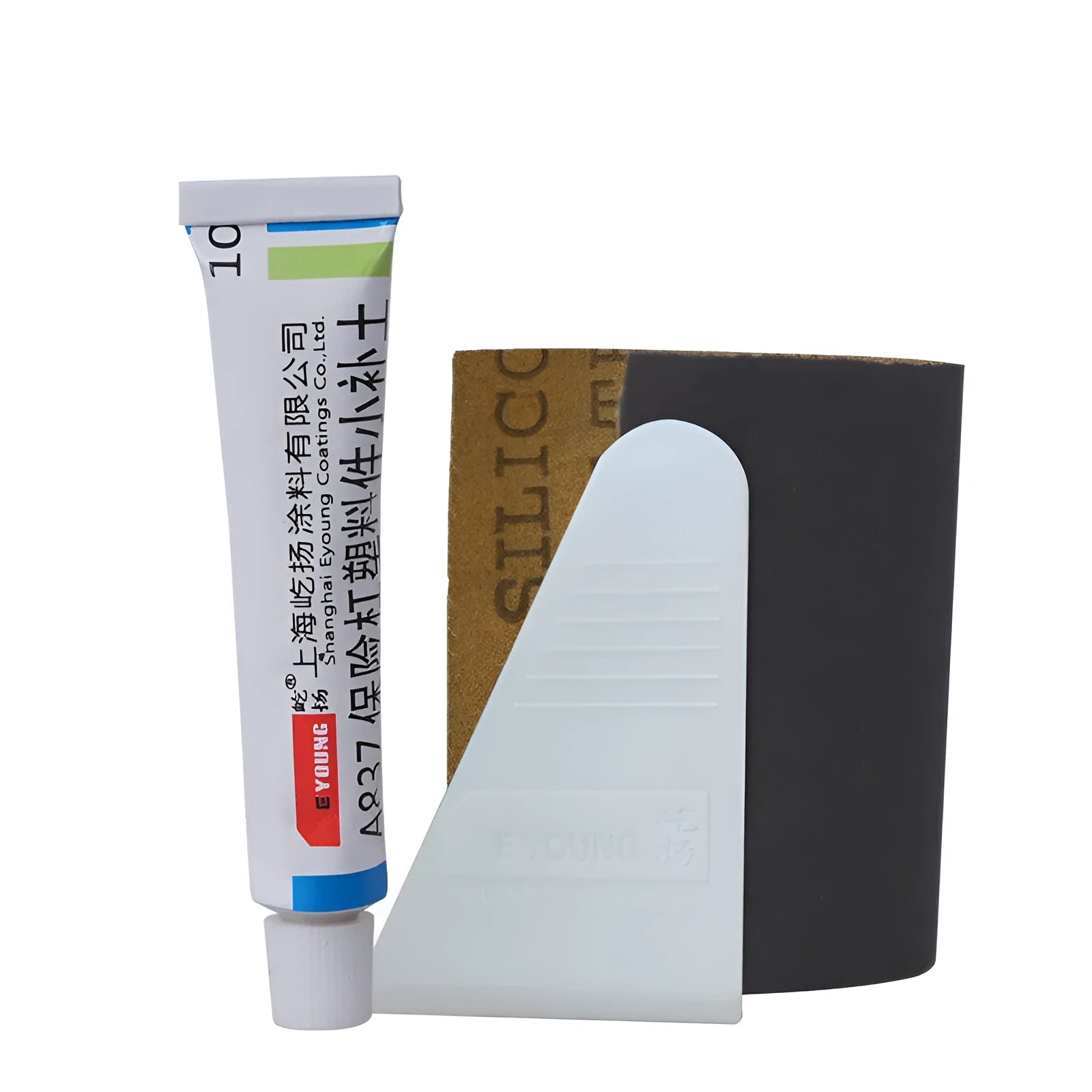 Car scratch repair kit with polishing wax, sandpaper, sponge, cloth, scraper, and brush on workbench