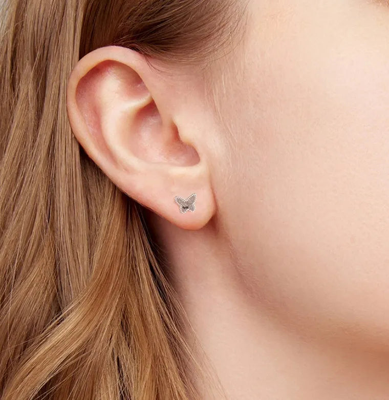 Pair of original S925 sterling silver butterfly stud earrings with shiny electroplated finish on white background