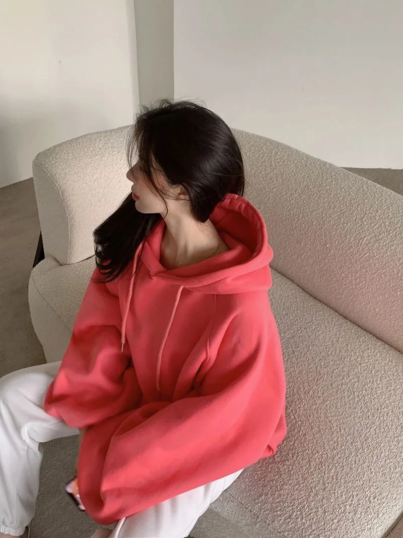 Watermelon red women's sleeveless hooded sweater in mulberry silk fabric on hanger